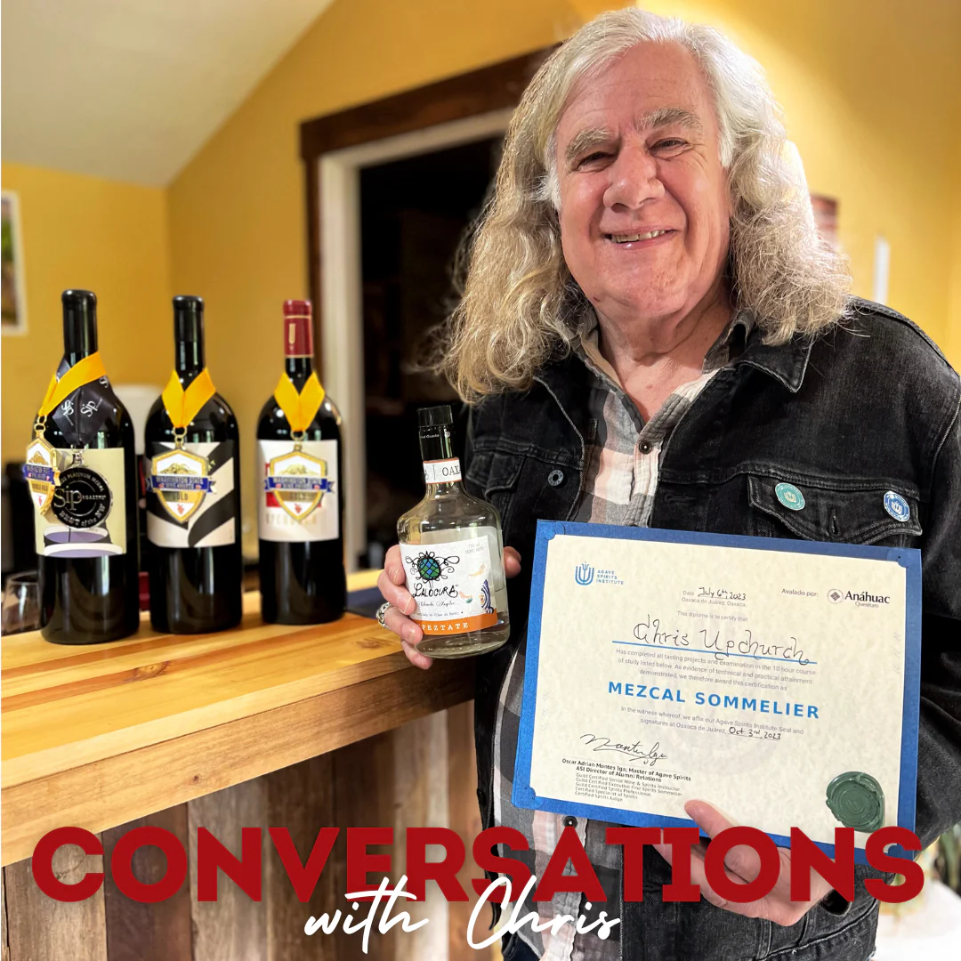 Chris Upchurch holding a mezcal sommelier certificate