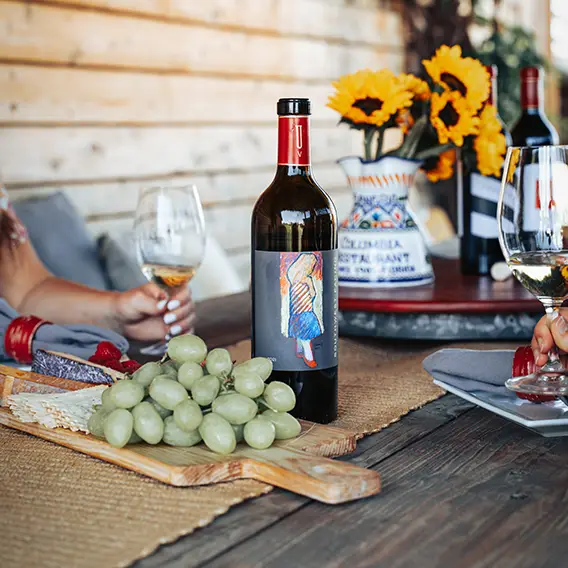 Club members enjoying wines and food at Upchurch Vineyard